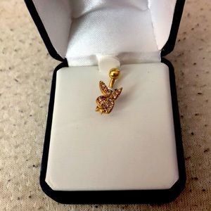 New Playboy bellybutton ring . Has a red diamond
